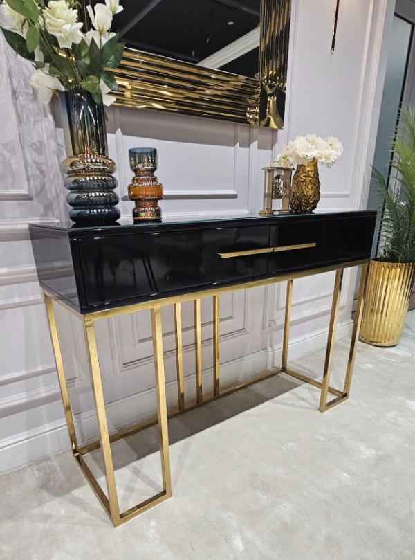 KONSOLA Naomi z dwiema szufladami, czarny połyskujący blat, złoty stelaż, styl glamour 120 cm, ekskluzywna