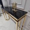 KONSOLA na złotym, błyszczącym stelażu Castillo z czarnym blatem z konglomeratu marmurowego, nowoczesne glamour, ekskluzywna KONSOLA na złotym, błyszczącym stelażu Castillo z czarnym blatem z konglomeratu marmurowego, nowoczesne glamour, ekskluzywna