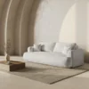 SOFA Ella z funkcją spania, tapicerka boucle w jasnobeżowym wydaniu, zaoblone kształty, designerski styl, piękna
