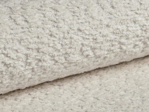 SOFA Ella z funkcją spania, tapicerka boucle w jasnobeżowym wydaniu, zaoblone kształty, designerski styl, tkanina