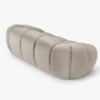 SOFA 2-osobowa Diana o zaoblonych kształtach, pionowe przeszycia, beżowa tkanina, designerski styl, ekskluzywna