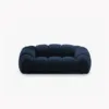 SOFA 2-osobowa Diana o zaoblonych kształtach, pionowe przeszycia, ciemnoniebieska tkanina, designerski styl
