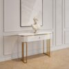 KONSOLA Anne na złotych błyszczących nogach, bialy korpus z ryflowaniem po bokach i praktyczną szufladą, złote detale, ekskluzywna KONSOLA Anne na złotych błyszczących nogach, bialy korpus z ryflowaniem po bokach i praktyczną szufladą, złote detale, ekskluzywna