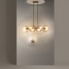 LAMPA WISZĄCA Aster na złotej, metalowej oprawie, podłużna, szklane koła z dekoracyjnymi żłobieniami, nowoczesny styl, wysoka jakość
