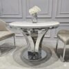 STÓŁ Amelie srebrny okrągły do jadalni, unikatowy kształt podstawy, blat - konglomerat marmurowy, glamour