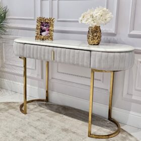TOALETKA na złotych nogach, korpus obity szaro-beżową tkaniną, eleganckie przeszycia, blat z konglomeratu marmurowego