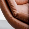 FOTEL OBROTOWY tapicerowany brązową ekoskórą, piękne poziome przeszycia, czarne stalowe nogi, do salonu FOTEL OBROTOWY tapicerowany brązową ekoskórą, piękne poziome przeszycia, czarne stalowe nogi, do salonu