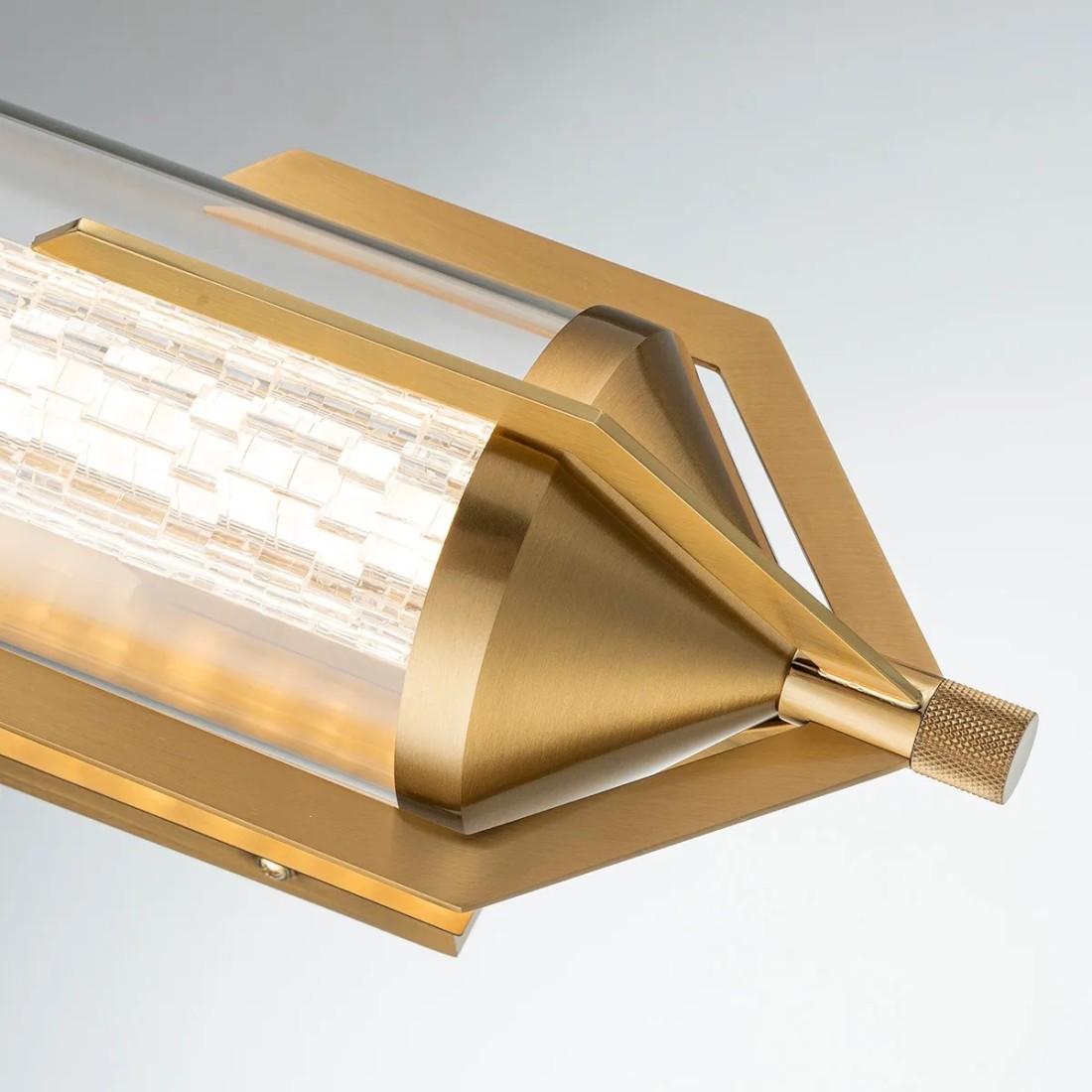 KINKIET Espada szczotkowane złoto, metalowe zakończenie w formie „płetwy ogonowej”, szklany centralny cylinder, piękny KINKIET Espada szczotkowane złoto, metalowe zakończenie w formie „płetwy ogonowej”, szklany centralny cylinder, piękny