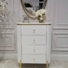KOMODA Anne Fosco biała z czterema szufladami, ryflowany korpus, złote szczotkowane detale, nowoczesny styl