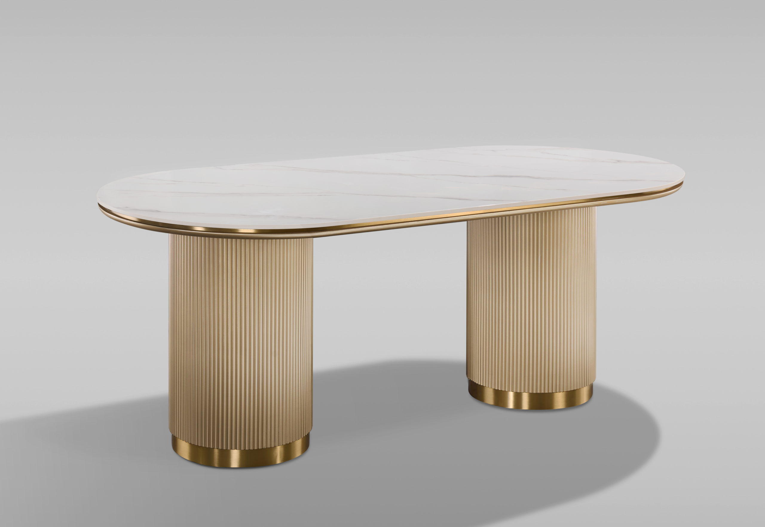 STÓŁ JADALNIANY w kolorze szampańskiego złota, nogi w kształcie walca, z pionowym ryflowaniem, owalny brat z marmuru syntetycznego, piękny