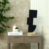 FIGURKA DEKORACYJNA abstrakcyjna forma twarzy, czarna, złota podstawa, metalowa, designerska, piękna FIGURKA DEKORACYJNA abstrakcyjna forma twarzy, czarna, złota podstawa, metalowa, designerska, piękna