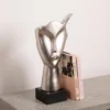 FIGURKA DEKORACYJNA srebrna, kształt twarzy, czarna podstawa, designerski styl