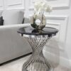 STOLIK POMOCNICZY Emporio Silver okrągły, na srebrnej, błyszczącej zakręconej podstawie, czarny blat z konglomeratu marmurowego, designerski styl